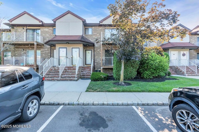 4511 Birchwood Ct, North Brunswick, NJ 08902 - view of front of property featuring uncovered parking and brick siding