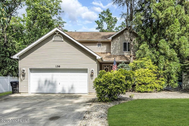 156 Magnolia Ln, Middletown, NJ 07748 - view of property exterior featuring driveway, a garage, and a lawn