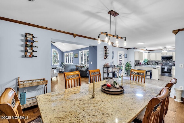 156 Magnolia Ln, Middletown, NJ 07748 - dining space with ornamental molding, a ceiling fan, light wood finished floors, and a chandelier