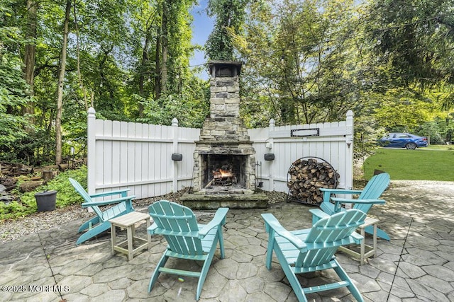156 Magnolia Ln, Middletown, NJ 07748 - view of patio / terrace with an outdoor stone fireplace and view of scattered trees
