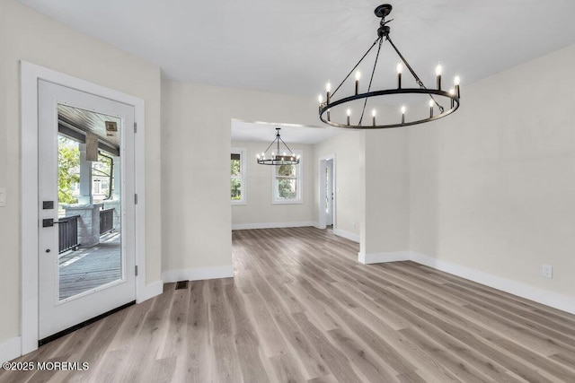 420 Philadelphia Ave, Egg Harbor City, NJ 08215 - unfurnished dining area featuring a chandelier and wood finished floors