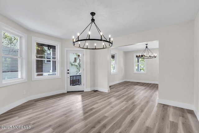 420 Philadelphia Ave, Egg Harbor City, NJ 08215 - unfurnished dining area featuring a chandelier and light wood-type flooring