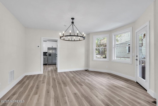 420 Philadelphia Ave, Egg Harbor City, NJ 08215 - unfurnished dining area featuring a chandelier and light wood-style flooring