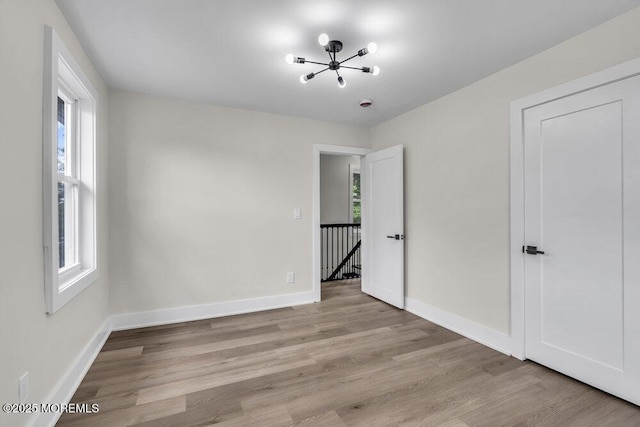 420 Philadelphia Ave, Egg Harbor City, NJ 08215 - empty room with a chandelier and light wood finished floors
