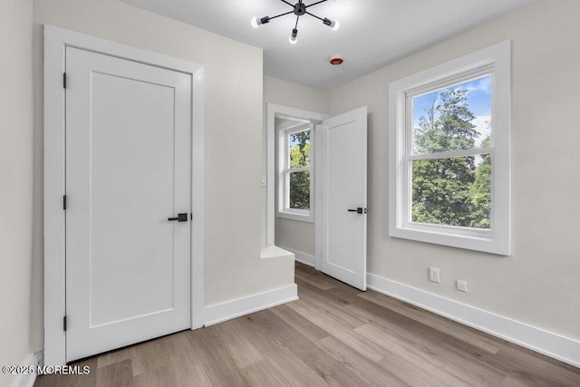 420 Philadelphia Ave, Egg Harbor City, NJ 08215 - unfurnished bedroom with wood finished floors and multiple windows