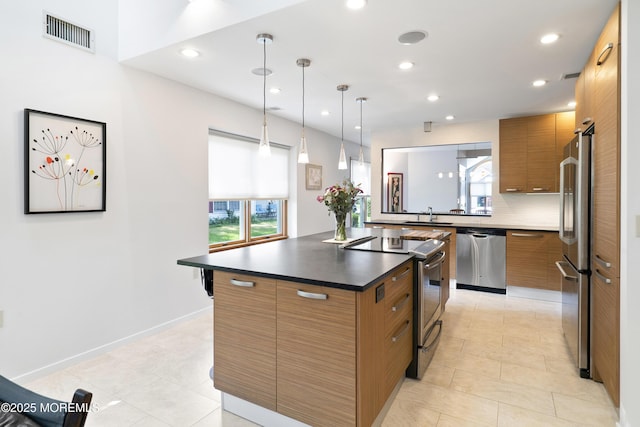 1714 Buttonwood Ave, Toms River, NJ 08755 - kitchen featuring appliances with stainless steel finishes, dark countertops, brown cabinetry, recessed lighting, and modern cabinets