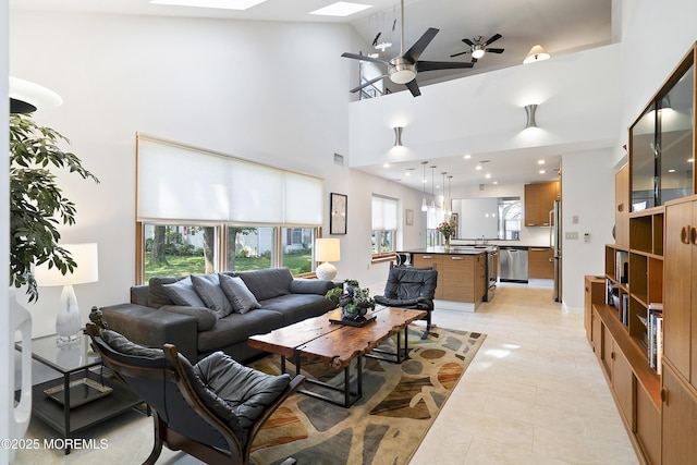 1714 Buttonwood Ave, Toms River, NJ 08755 - living room with plenty of natural light, a ceiling fan, a towering ceiling, and light tile patterned floors