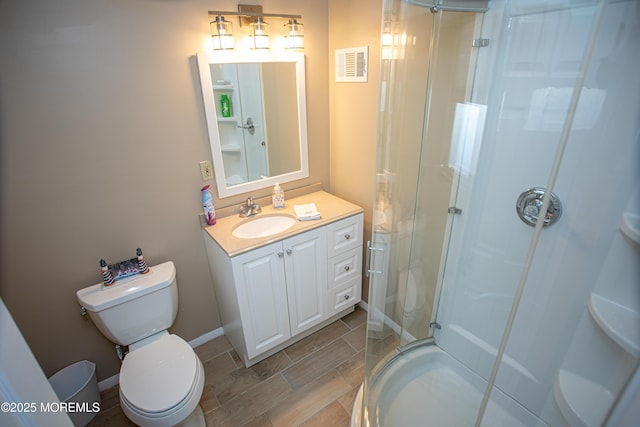 36 Cori St, Parlin, NJ 08859 - bathroom with a shower stall, vanity, and wood finish floors