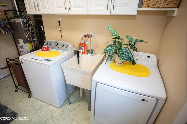 36 Cori St, Parlin, NJ 08859 - laundry room featuring independent washer and dryer, cabinet space, light marble finish floors, and water heater