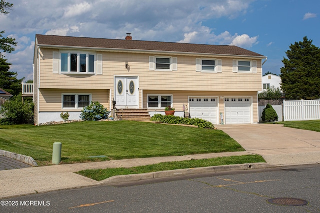 36 Cori St, Parlin, NJ 08859 - raised ranch featuring a garage, driveway, and a chimney