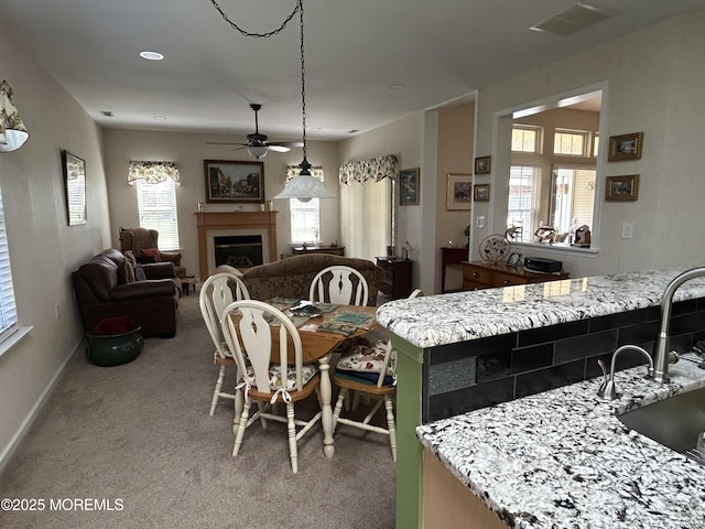 7 Fontaine Ct, Manchester, NJ 08759 - dining area featuring a ceiling fan, light carpet, and a fireplace