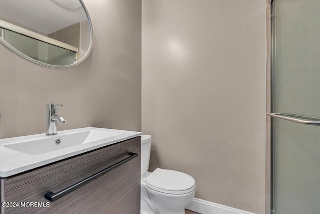 321 6th Ave Unit 103, Asbury Park, NJ 07712 - bathroom with vanity and a shower with shower door