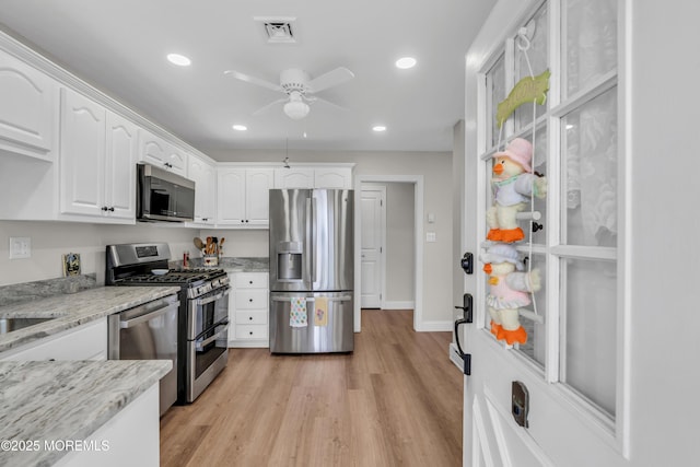 66B Buckingham Dr, Manchester, NJ 08759 - kitchen featuring stainless steel appliances, white cabinetry, ceiling fan, light stone counters, and recessed lighting