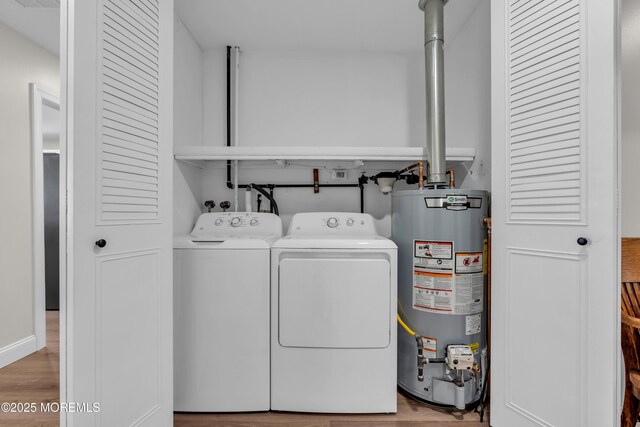 66B Buckingham Dr, Manchester, NJ 08759 - washroom with water heater, wood finished floors, and washer and clothes dryer