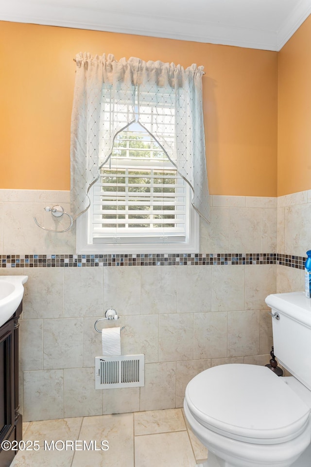 26 N Boston Rd, Jackson, NJ 08527 - half bathroom featuring tile walls, crown molding, a wainscoted wall, vanity, and tile patterned floors