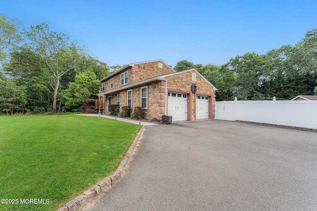 26 N Boston Rd, Jackson, NJ 08527 - view of front of home with stone siding, asphalt driveway, and a garage