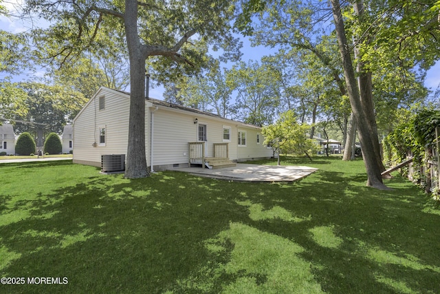 74 Brand Rd, Toms River, NJ 08753 - back of property featuring a lawn and a patio area