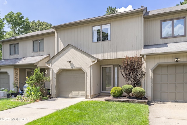 48 Carmel Ct, Old Bridge, NJ 08857 - view of property featuring concrete driveway, a front lawn, and a garage
