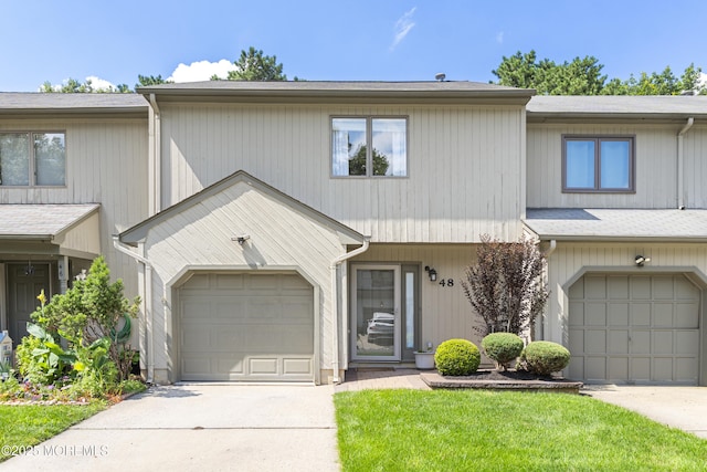 48 Carmel Ct, Old Bridge, NJ 08857 - townhome / multi-family property with concrete driveway and a garage