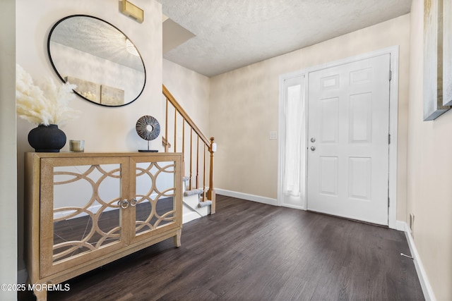 48 Carmel Ct, Old Bridge, NJ 08857 - entrance foyer featuring dark wood-style flooring, stairway, and a textured ceiling