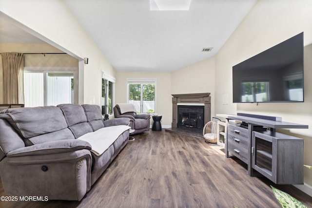 48 Carmel Ct, Old Bridge, NJ 08857 - living room featuring wood finished floors, lofted ceiling, and a glass covered fireplace
