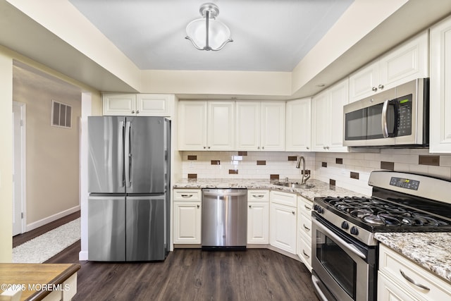 48 Carmel Ct, Old Bridge, NJ 08857 - kitchen featuring appliances with stainless steel finishes, dark wood-style flooring, and white cabinetry