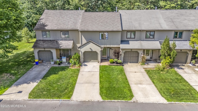 48 Carmel Ct, Old Bridge, NJ 08857 - view of property with a front yard, driveway, and a garage