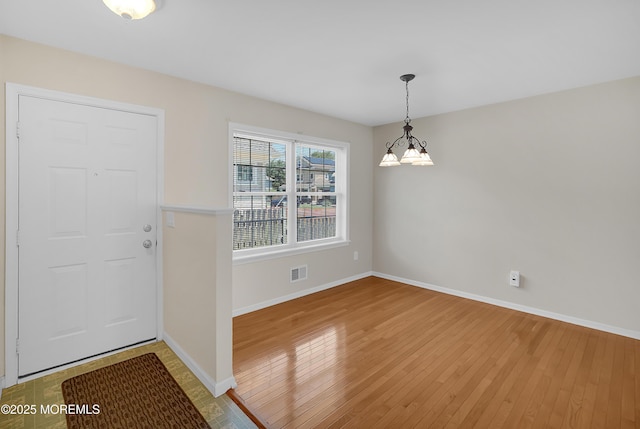 305 11th Ave, Spring Lake Heights, NJ 07762 - entryway featuring light wood-type flooring and a chandelier