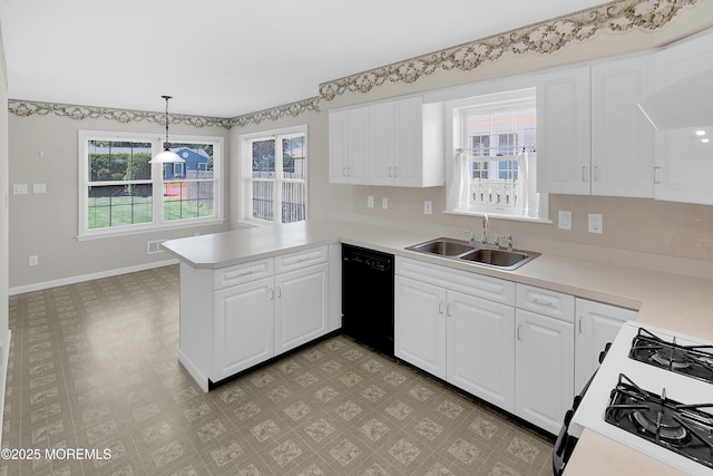 305 11th Ave, Spring Lake Heights, NJ 07762 - kitchen featuring black dishwasher, a peninsula, light countertops, range with gas stovetop, and white cabinetry