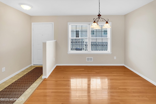 305 11th Ave, Spring Lake Heights, NJ 07762 - unfurnished dining area featuring light wood-type flooring and baseboards