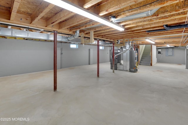 305 11th Ave, Spring Lake Heights, NJ 07762 - basement featuring stairs, water heater, and heating unit