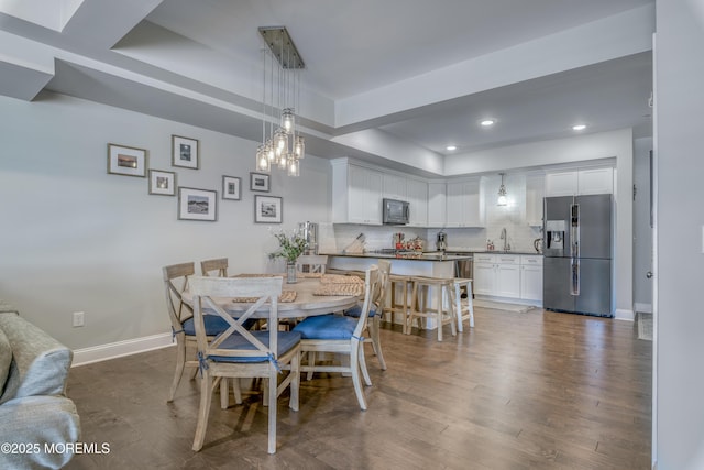 26 9th Ave Unit 105, Ortley Beach, NJ 08751 - dining room with a tray ceiling, dark wood-style flooring, a chandelier, and recessed lighting