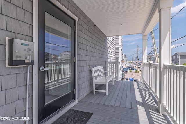 26 9th Ave Unit 105, Ortley Beach, NJ 08751 - view of wooden porch