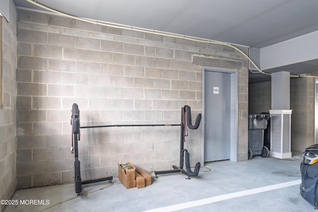 26 9th Ave Unit 105, Ortley Beach, NJ 08751 - garage featuring concrete block wall