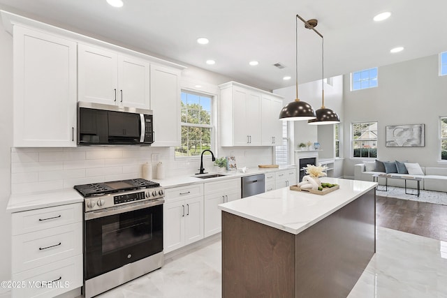 2 Muirwood Ct, Jackson, NJ 08527 - kitchen with appliances with stainless steel finishes, plenty of natural light, a kitchen island, white cabinetry, and recessed lighting
