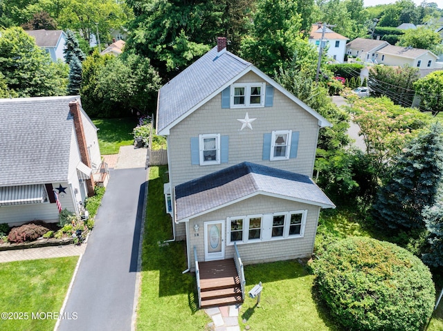 18 Holly St, Rumson, NJ 07760 - view of front of property featuring a chimney, a front lawn, and view of wooded area