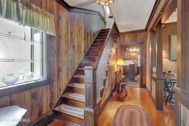 18 Holly St, Rumson, NJ 07760 - stairway featuring wood walls, wood finished floors, and a baseboard heating unit