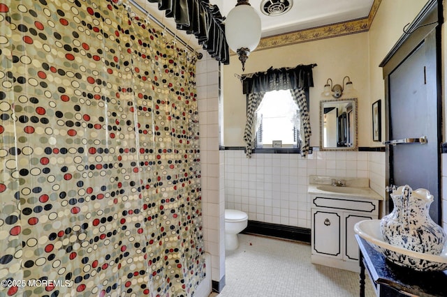 18 Holly St, Rumson, NJ 07760 - bathroom with vanity, tile walls, tile patterned floors, a shower, and wainscoting