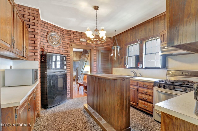18 Holly St, Rumson, NJ 07760 - kitchen with stainless steel appliances, light countertops, a chandelier, ornamental molding, and decorative light fixtures
