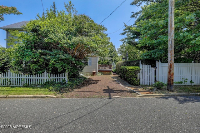 18 Holly St, Rumson, NJ 07760 - view of front of property featuring a fenced front yard, a wooden deck, and a gate
