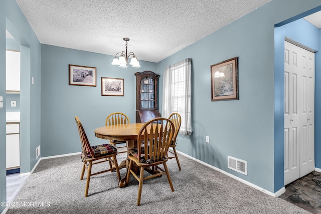 1002 Morning Glory Ct, Jackson, NJ 08527 - dining room featuring a textured ceiling, a chandelier, and carpet flooring