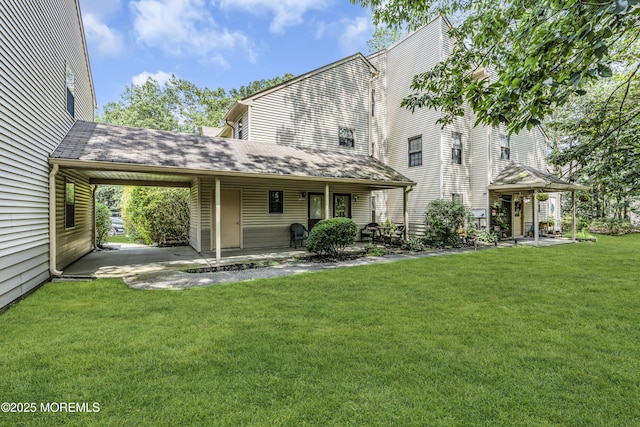 1002 Morning Glory Ct, Jackson, NJ 08527 - back of house featuring a lawn, a shingled roof, and a patio area