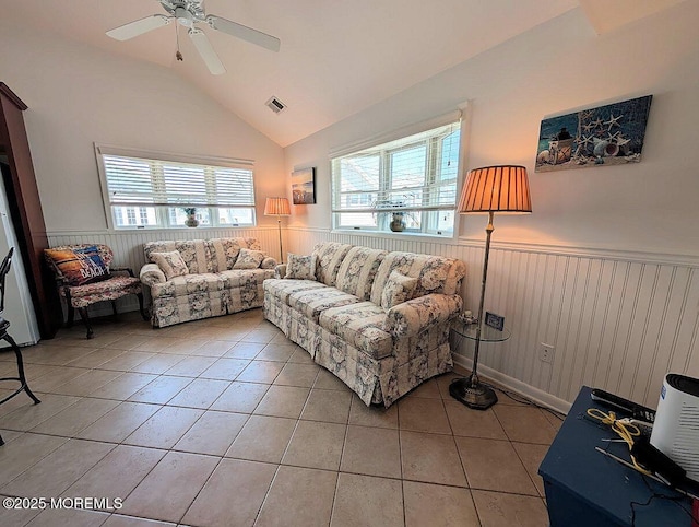 215 Harbor Dr, Lavallette, NJ 08735 - living area featuring a wainscoted wall, light tile patterned flooring, vaulted ceiling, plenty of natural light, and ceiling fan