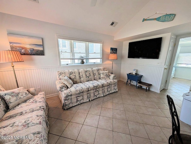 215 Harbor Dr, Lavallette, NJ 08735 - living area with light tile patterned flooring, wainscoting, and lofted ceiling