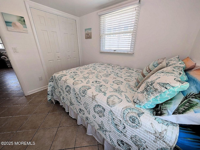 215 Harbor Dr, Lavallette, NJ 08735 - tiled bedroom featuring a closet and baseboards