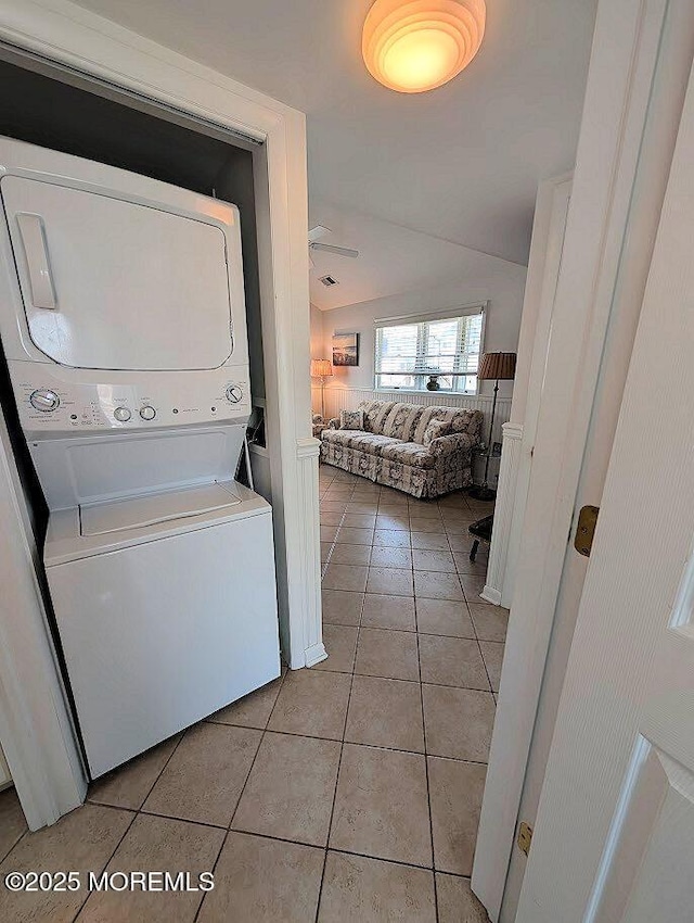 215 Harbor Dr, Lavallette, NJ 08735 - washroom featuring stacked washer and clothes dryer and light tile patterned floors