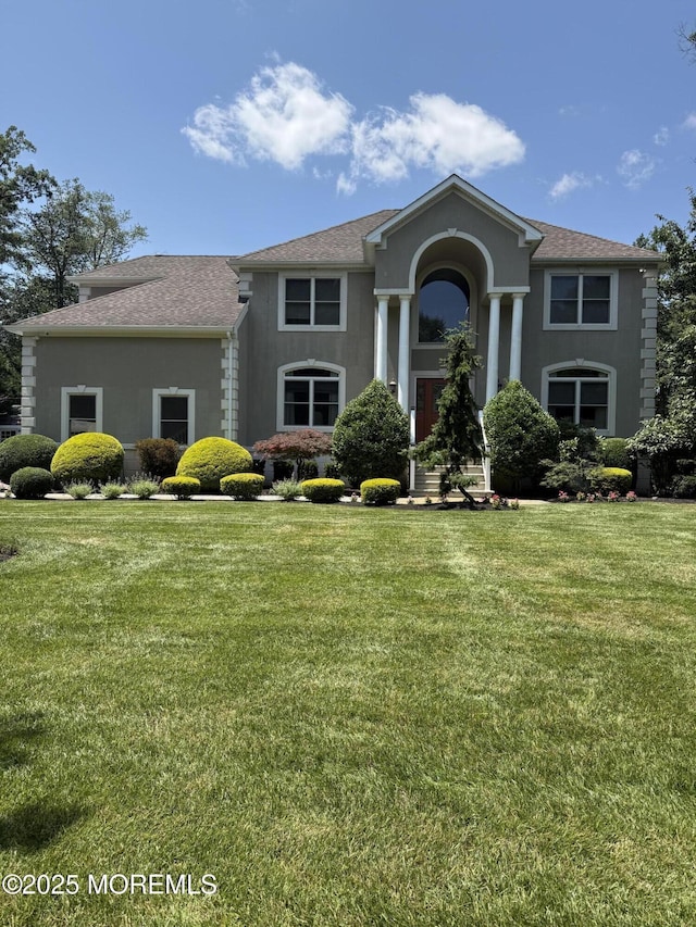 284 Friendship Rd, Howell, NJ 07731 - view of front of property featuring a front yard, roof with shingles, and stucco siding