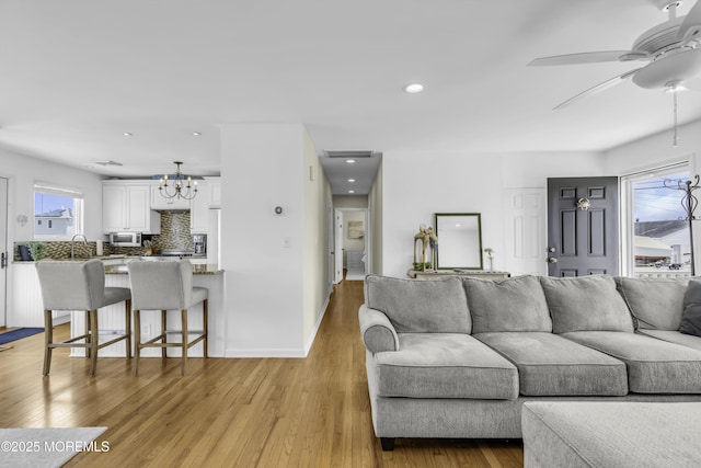 813 Tiller Dr, Forked River, NJ 08731 - living room featuring a chandelier, light wood-style floors, ceiling fan, and recessed lighting