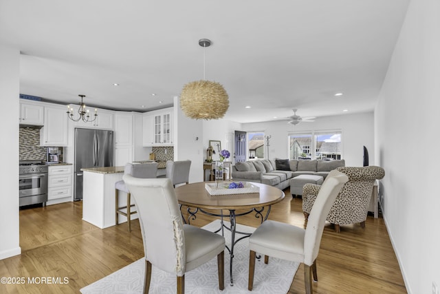 813 Tiller Dr, Forked River, NJ 08731 - dining area featuring light wood finished floors, a chandelier, recessed lighting, and ceiling fan