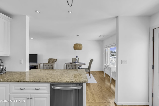 813 Tiller Dr, Forked River, NJ 08731 - kitchen featuring white cabinets, a peninsula, light wood-style floors, dishwasher, and light stone countertops